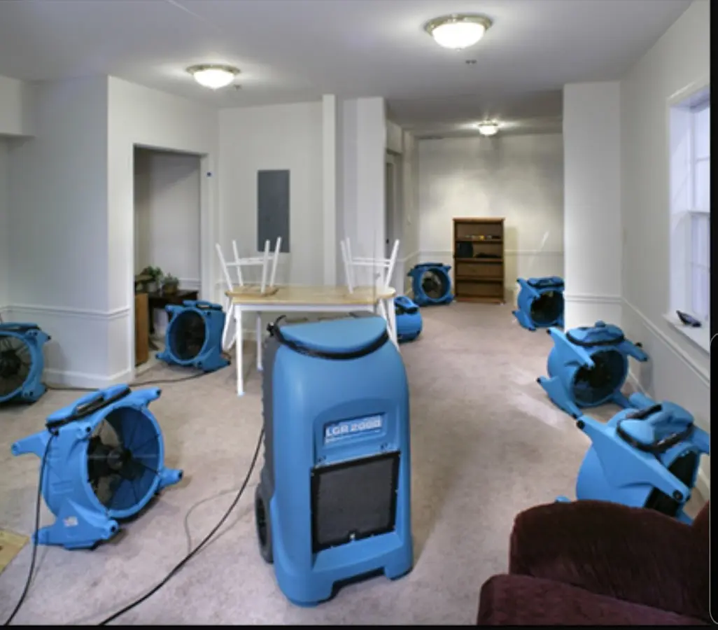Air movers and dehumidifier setup for Water Damage Restoration in Kochville